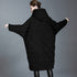 Back view of hooded long down coat with wide sleeves