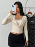 long sleeve crop top on model, light almond, draped cowl square neck, ruched waist, slim fit front view
