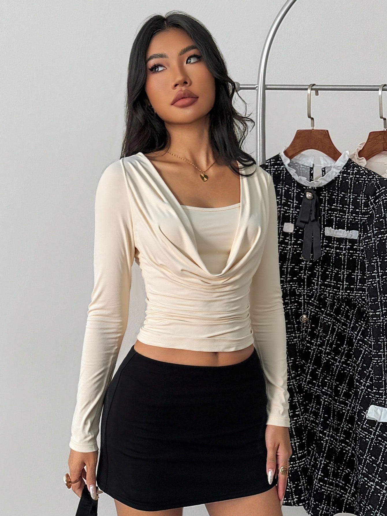 full-length front, long sleeve crop top in light almond, draped cowl, square neck, mini skirt styling