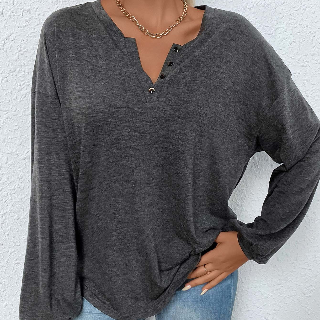 women’s long sleeve henley shirt in mélange, relaxed fit with split button neckline, front view hands in pocket