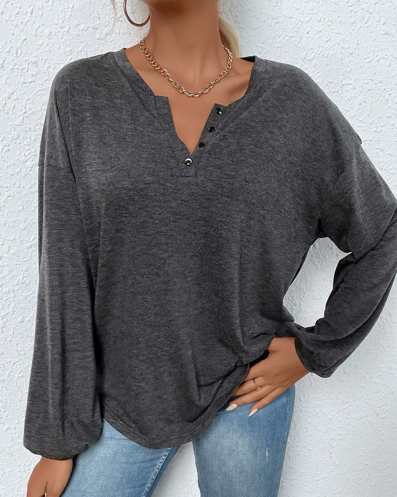 women’s long sleeve henley shirt in mélange, relaxed fit with split button neckline, front view hands in pocket