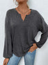 women’s long sleeve henley shirt in mélange, relaxed fit with split button neckline, front view hands in pocket