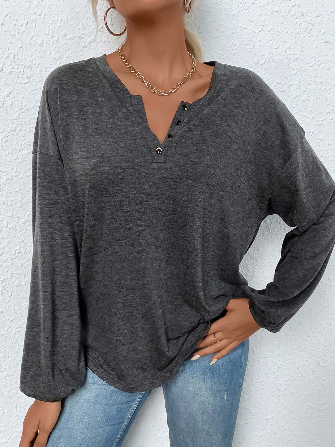 women’s long sleeve henley shirt in mélange, relaxed fit with split button neckline, front view hands in pocket