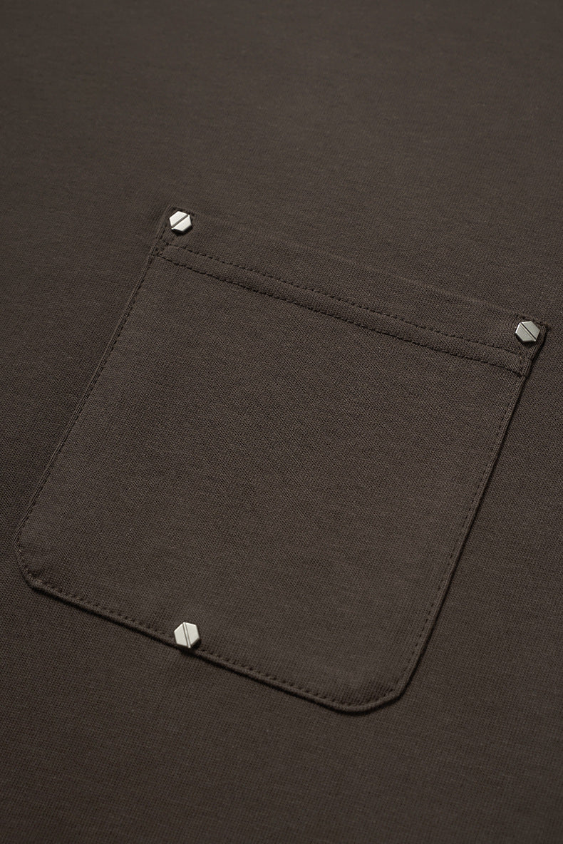 Studded pocket close-up on oversized long sleeve t-shirt men