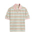 Flat lay of pastel pink striped polo shirt with pink collar and cuffs on white background.