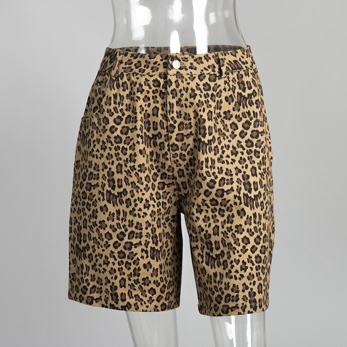 Khaki Yellow leopard print cotton shorts with front pockets and button closure in mannequin