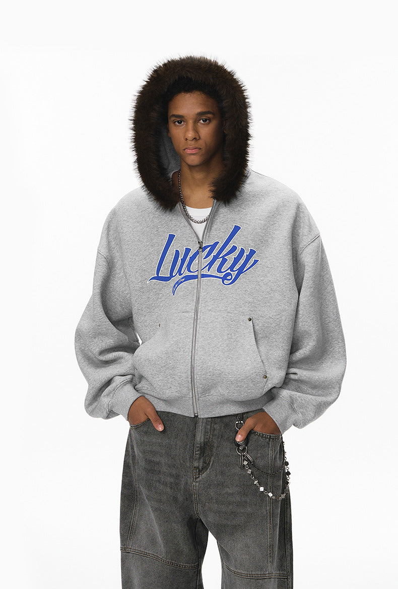 Male model in gray jacket with fur hood up, front view.