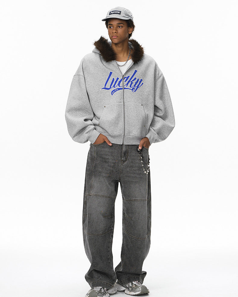 Model wearing gray fur-hood zip jacket, full body front.