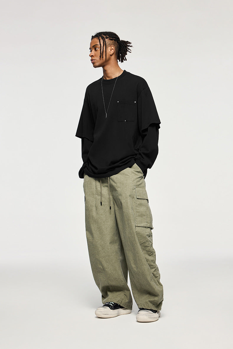 Man in oversized black long sleeve t-shirt with layered effect