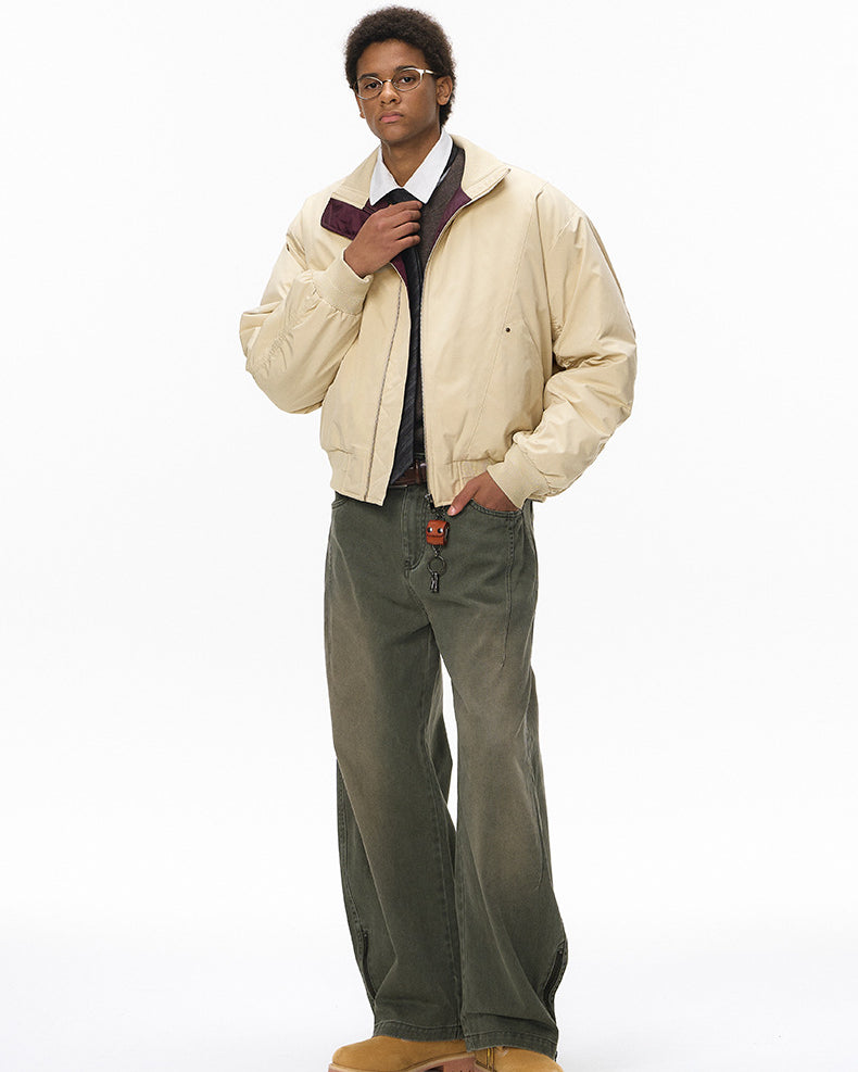 Beige stand-collar bomber, zip closed, hands in pockets, front view