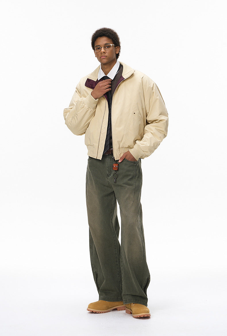 Beige stand-collar bomber, zip closed, hands in pockets, front view