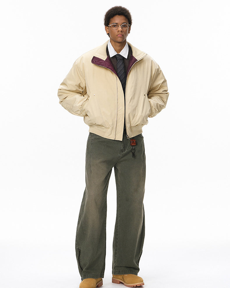Model in beige men bomber jacket with green pants, relaxed pose