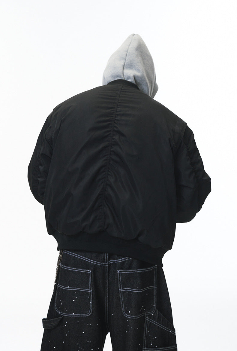 Black bomber jacket rear view showing gathered back panel