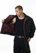 Black bomber jacket, hands in pockets, clean street fit