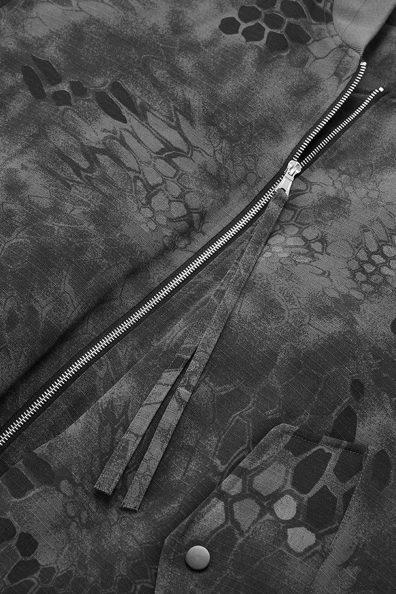 Sleeve zipper and puller detail close-up on dark gray bomber jacket