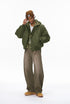 Man in olive men bomber jacket, zip open, relaxed street fit