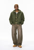 Full-length olive bomber jacket, hands in pockets, hood down