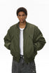Olive men bomber jacket, zip closed, casual street pose