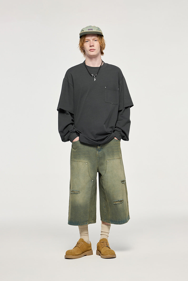 Man in oversized carbon gray long sleeve t-shirt with layered effect