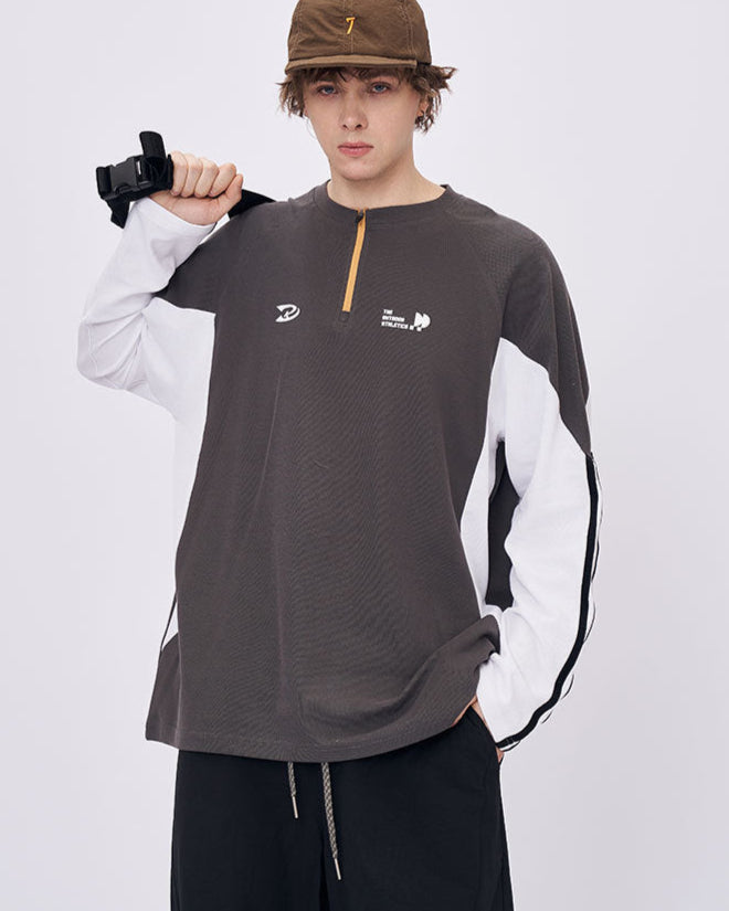 Man wearing gray retro contrast long sleeve t-shirt with cap casual look