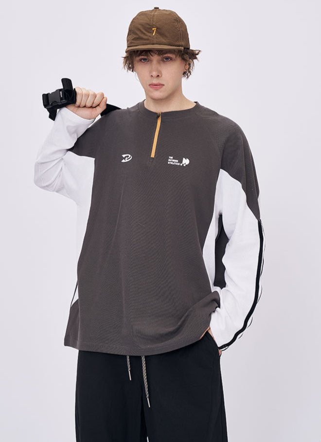 Man wearing gray retro contrast long sleeve t-shirt with cap casual look