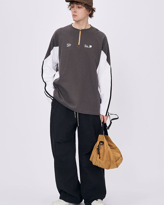Man front view wearing gray retro contrast long sleeve t-shirt with white sleeves