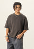 Half length front view of model wearing a charcoal grey 280G french terry raw edge short sleeve tee.