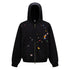 Front product shot of a mens washed black boxy zip up hoodie featuring all-over retro graphic patches on white background.