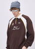 Close up of men’s brown embroidered polo collar long sleeve t-shirt