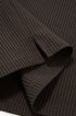 Close-up of brown long sleeve t shirt waffle knit seagull collar fabric with a waffle pattern.