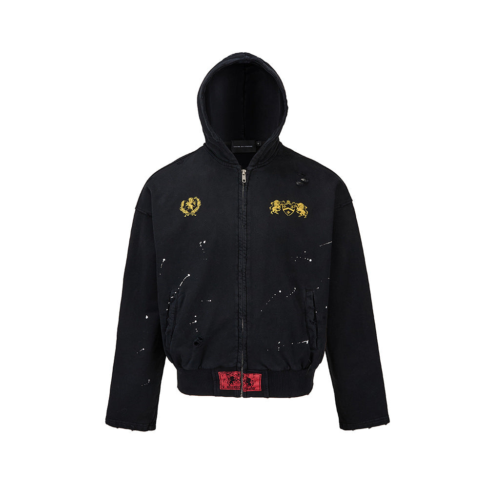 Front product shot of a mens washed black distressed zip up hoodie featuring mothholes and paint splatter details.