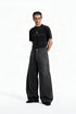 Full length view of model wearing charcoal gray fleece lined wide leg curved seam cargo pants with black tee.
