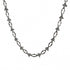 Close-up of silver barbed wire necklace with angular twisted links on white background.