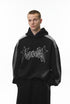 Black graphic hoodie on model, relaxed fit with drop shoulders, front.