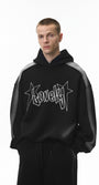Black graphic hoodie on model, relaxed fit with drop shoulders, front.