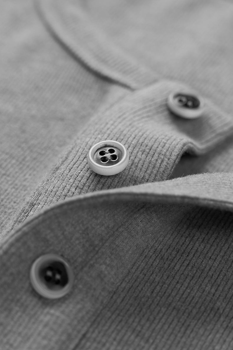 Close-up gray men’s henley long sleeve t-shirt oversized button detail