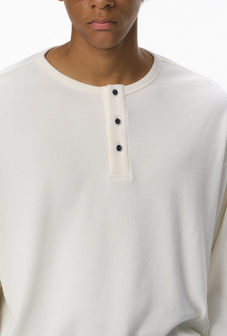 Off-White long-sleeve henley t shirt with black buttons worn by a person on a white background