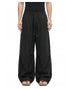 Men's black wide-leg pants showing elastic drawstring waist and curved leg shaping.