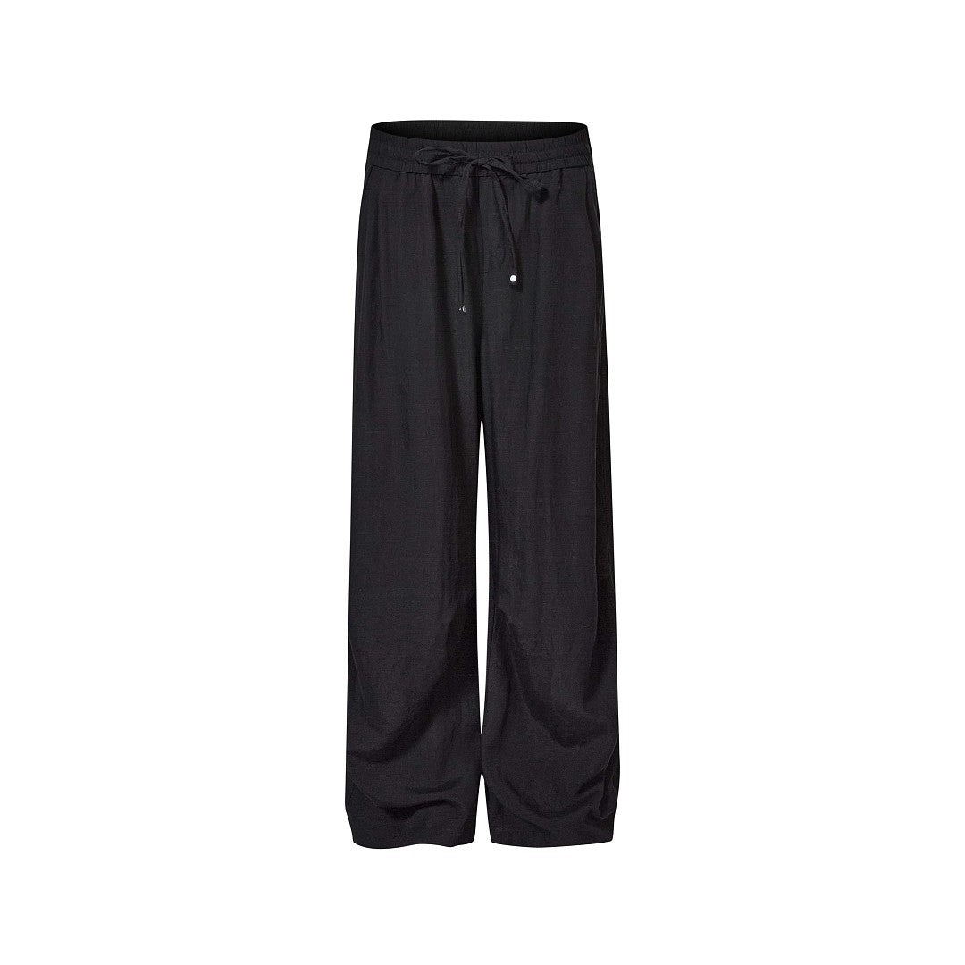 Black men's relaxed drawstring wide-leg pants isolated on white.
