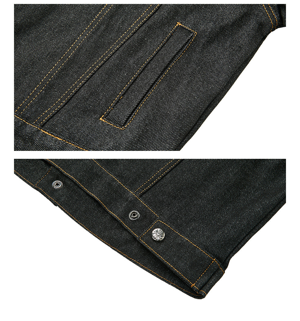 Close-up of dark indigo denim jacket welt pocket, contrast stitching, and decorative snap cuff