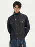 Three-quarter front close-up showing high collar, flap chest pockets, and snap button placket