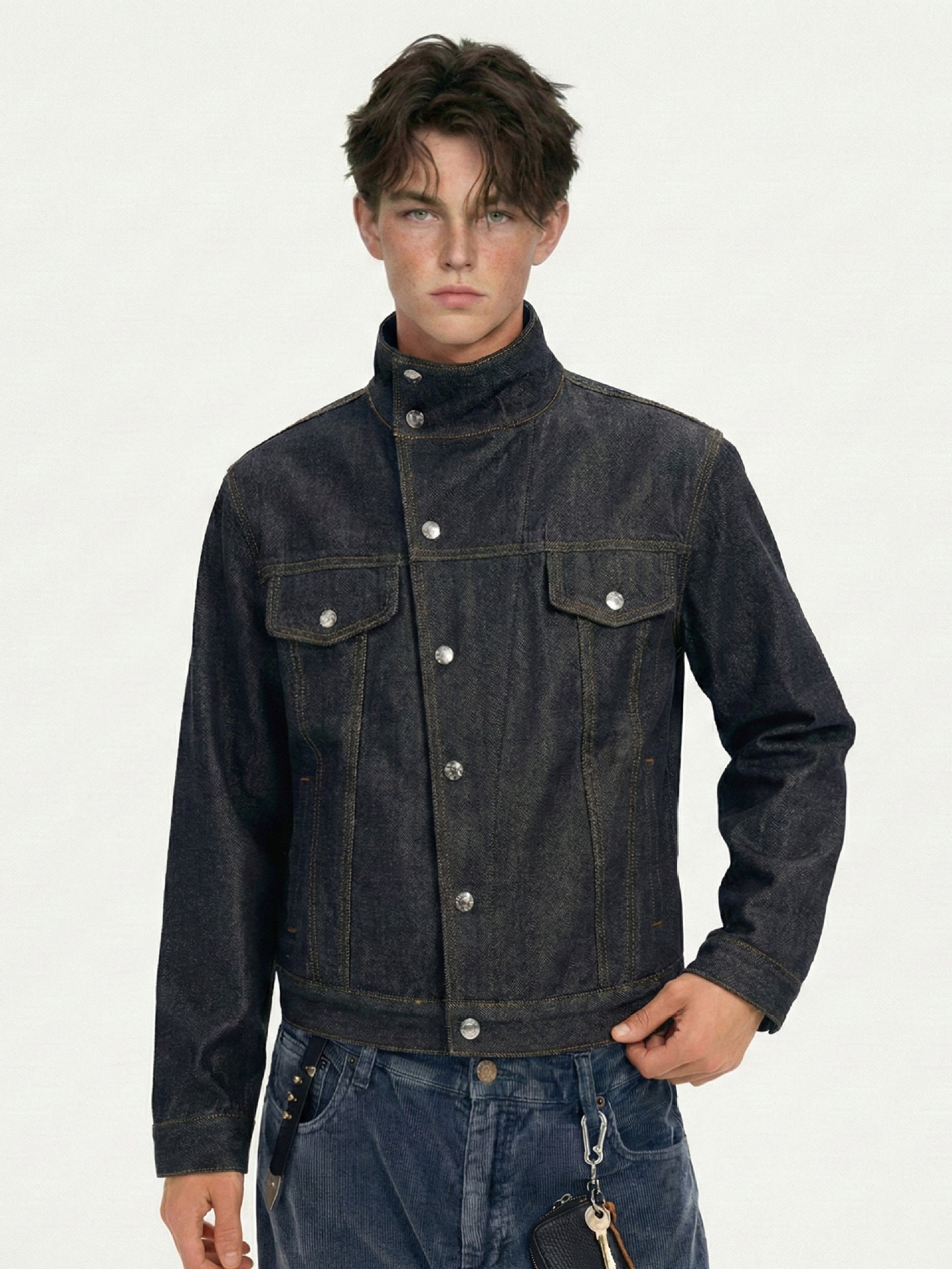 Front styling view of fitted dark indigo jacket with contrast seams and straight banded hem