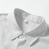 Close-up view of the spread collar and inner brand tag on a grey pinstripe dress shirt fabric.