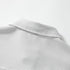 Close-up view of the chest patch pocket stitched on grey fine vertical pinstripe woven fabric.