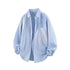 Front flat lay view of light blue vertical pinstripe long sleeve casual button down shirt.