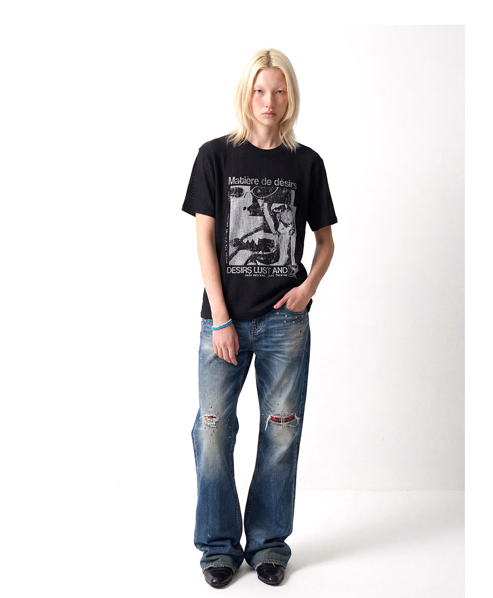Black open-knit graphic tee worn front-facing with blue wide-leg jeans. | 