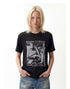 Close front view of black punk graphic tee showing ribbed open-knit texture.