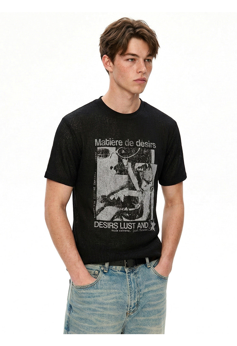 Three-quarter view of black punk tee paired with light-wash denim.