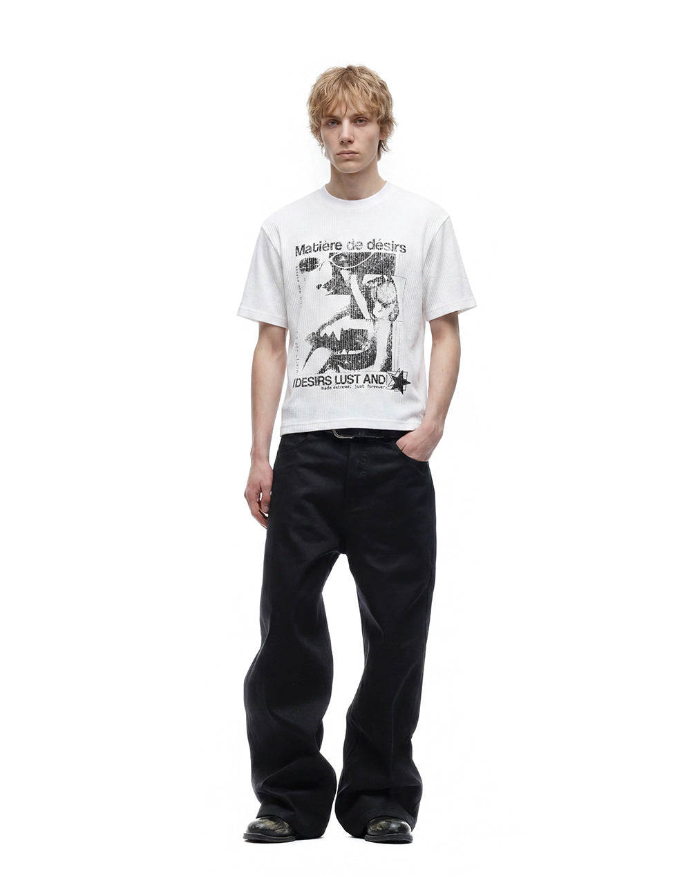 White open-knit graphic T-shirt styled with black wide-leg trousers.