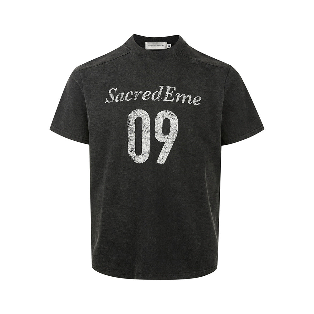 Blue-gray crewneck graphic T-shirt isolated on white with faded varsity design.